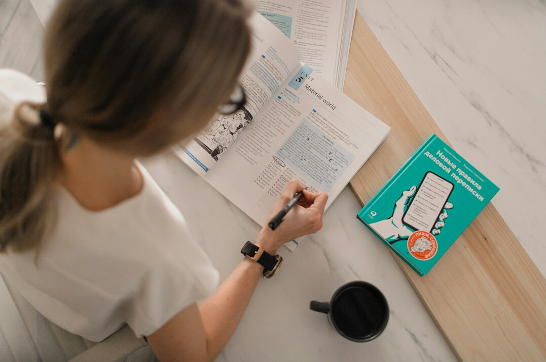 woman writing financial goals