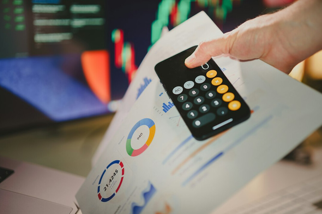 person reviewing financial charts